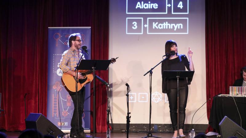 Jonathan Coulton leads a music parody game alongside Ophira Eisenberg on Ask Me Another at the Bell House in Brooklyn, New York. Jonathan Coulton leads a music parody game alongside Ophira Eisenberg on Ask Me Another at the Bell House in Brooklyn, New York.