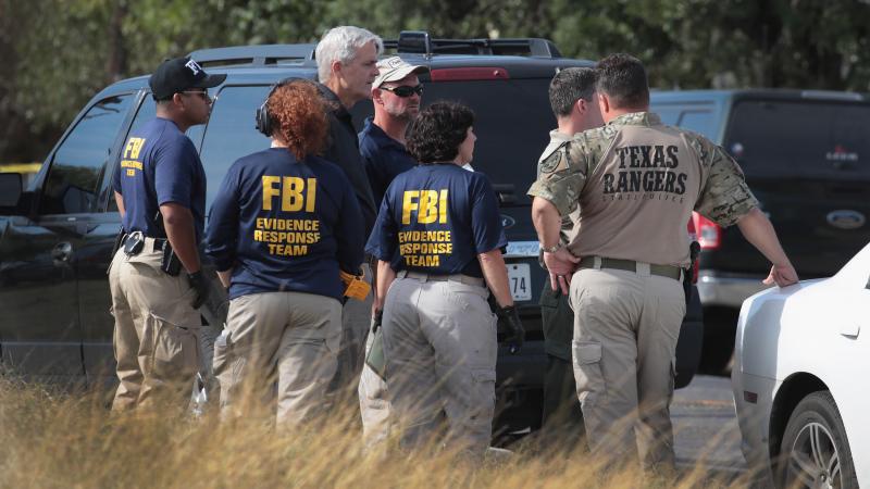 Law enforcement officials continue their investigation at the First Baptist Church of Sutherland Springs in Texas on Monday. Law enforcement officials continue their investigation at the First Baptist Church of Sutherland Springs in Texas on Monday.