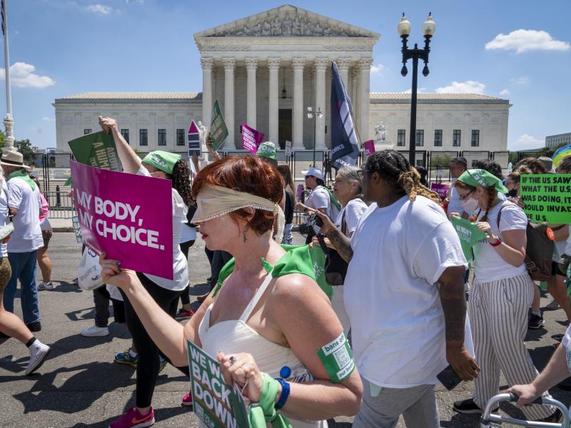 Mahayana Landowne, of Brooklyn, N.Y., wears a "Lady Justice" costume as she marches past the Supreme Court during a protest for abortion rights on June 30, 2022, in Washington, D.C. Mahayana Landowne, of Brooklyn, N.Y., wears a "Lady Justice" costume as she marches past the Supreme Court during a protest for abortion rights on June 30, 2022, in Washington, D.C.