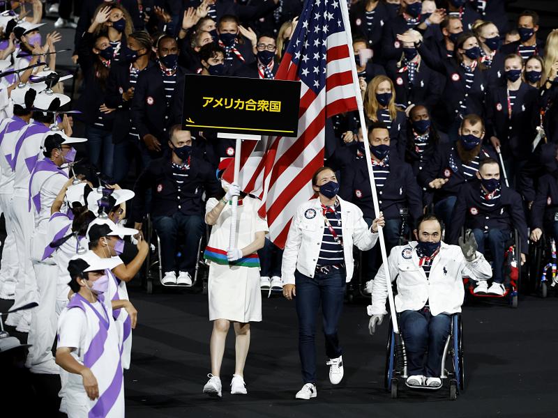 Flag bearers Melissa Stockwell and Charles Aoki of Team USA lead their delegation in the parade of athletes during the opening ceremony of the Tokyo 2020 Paralympic Games on August 24, 2021 in Tokyo, Japan. Flag bearers Melissa Stockwell and Charles Aoki of Team USA lead their delegation in the parade of athletes during the opening ceremony of the Tokyo 2020 Paralympic Games on August 24, 2021 in Tokyo, Japan.