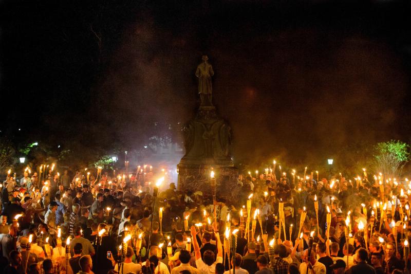 Neo-Nazis, white supremacists and other demonstrators encircle counterprotesters at the base of a statue of Thomas Jefferson on the University of Virginia campus in Charlottesville, Va., on Friday. Neo-Nazis, white supremacists and other demonstrators encircle counterprotesters at the base of a statue of Thomas Jefferson on the University of Virginia campus in Charlottesville, Va., on Friday.