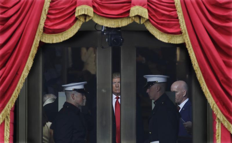 President-elect Donald Trump waits to step out onto the portico at the West Front of the U.S. Capitol for his inauguration. President-elect Donald Trump waits to step out onto the portico at the West Front of the U.S. Capitol for his inauguration.