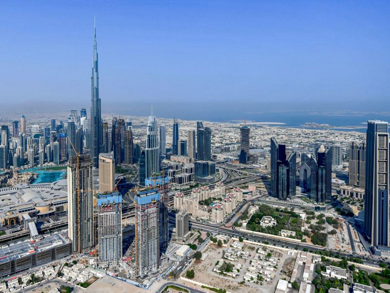 The United Arab Emirates is changing its workweek to have half days on Fridays and a Saturday-Sunday weekend. Here, the country's emirate of Dubai and its Burj Khalifa skyscraper are photographed from a helicopter on July 8, 2020. The United Arab Emirates is changing its workweek to have half days on Fridays and a Saturday-Sunday weekend. Here, the country's emirate of Dubai and its Burj Khalifa skyscraper are photographed from a helicopter on July 8, 2020.