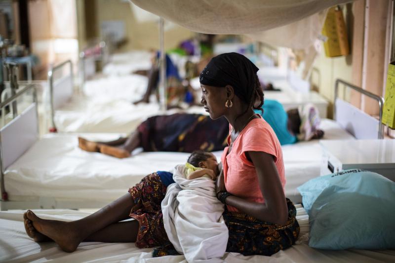 Maternal mortality rates are going down because of better health services. Above: A mother nurses her newborn at a maternity ward in Sierra Leone. Maternal mortality rates are going down because of better health services. Above: A mother nurses her newborn at a maternity ward in Sierra Leone.
