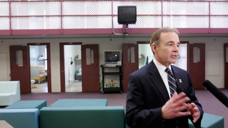 Garry Mead, assistant director of detention and removal for Immigration and Customs Enforcement, answers a reporter's question in 2007 in front of cells that housed immigrant families at the T. Don Hutto Residential Center in Taylor, Texas. After a suit b Garry Mead, assistant director of detention and removal for Immigration and Customs Enforcement, answers a reporter's question in 2007 in front of cells that housed immigrant families at the T. Don Hutto Residential Center in Taylor, Texas. After a suit b