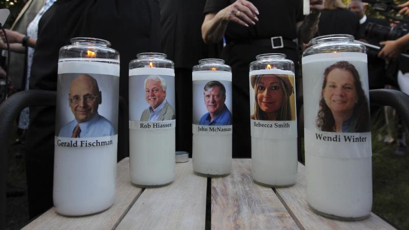 The photos of five people slain in the Capital Gazette newsroom adorn candles at a vigil in June. The attack was mentioned in the analysis of Reporters Without Borders' annual World Press Freedom Index. The photos of five people slain in the Capital Gazette newsroom adorn candles at a vigil in June. The attack was mentioned in the analysis of Reporters Without Borders' annual World Press Freedom Index.