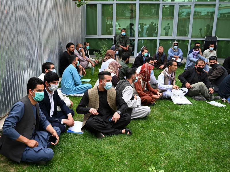 Former interpreters for U.S. and NATO forces gather during a demonstration in downtown Kabul, Afghanistan, on April 30, on the eve of the beginning of Washington's troop withdrawal. Former interpreters for U.S. and NATO forces gather during a demonstration in downtown Kabul, Afghanistan, on April 30, on the eve of the beginning of Washington's troop withdrawal.