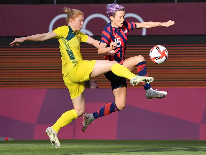 Australia's defender Clare Polkinghorne (left) fights for the ball with Team USA forward Megan Rapinoe during the women's bronze medal soccer match on Thursday at the Tokyo Olympics. Australia's defender Clare Polkinghorne (left) fights for the ball with Team USA forward Megan Rapinoe during the women's bronze medal soccer match on Thursday at the Tokyo Olympics.