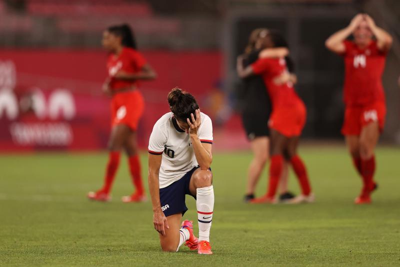 Carli Lloyd of the U.S. women's soccer team looks dejected after Monday's defeat in the semifinal match against Canada at the Tokyo Olympics. Carli Lloyd of the U.S. women's soccer team looks dejected after Monday's defeat in the semifinal match against Canada at the Tokyo Olympics.