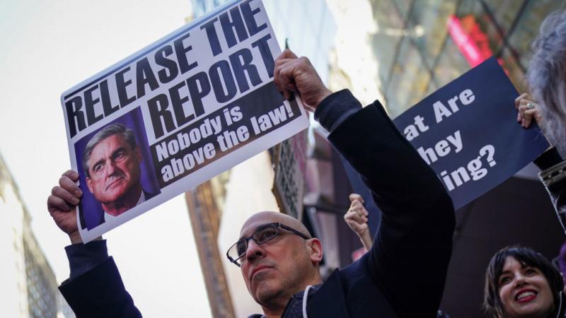 Activists participate in a Release the Report rally in Times Square on April 4 in New York City. Activists participate in a Release the Report rally in Times Square on April 4 in New York City.