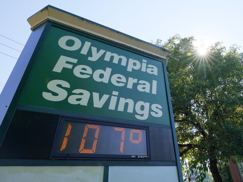 A display at an Olympia Federal Savings branch shows a temperature of 107 degrees Fahrenheit on Monday in the early evening in Olympia, Wash. A display at an Olympia Federal Savings branch shows a temperature of 107 degrees Fahrenheit on Monday in the early evening in Olympia, Wash.