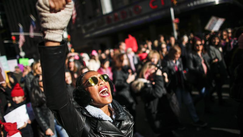 A woman shouts slogans during the Women's March in New York City, January 20, 2018, as protestors took to the streets en masse across the United States. It was a sign of lasting outrage, coming a year after the first women's marches following President Tr A woman shouts slogans during the Women's March in New York City, January 20, 2018, as protestors took to the streets en masse across the United States. It was a sign of lasting outrage, coming a year after the first women's marches following President Tr