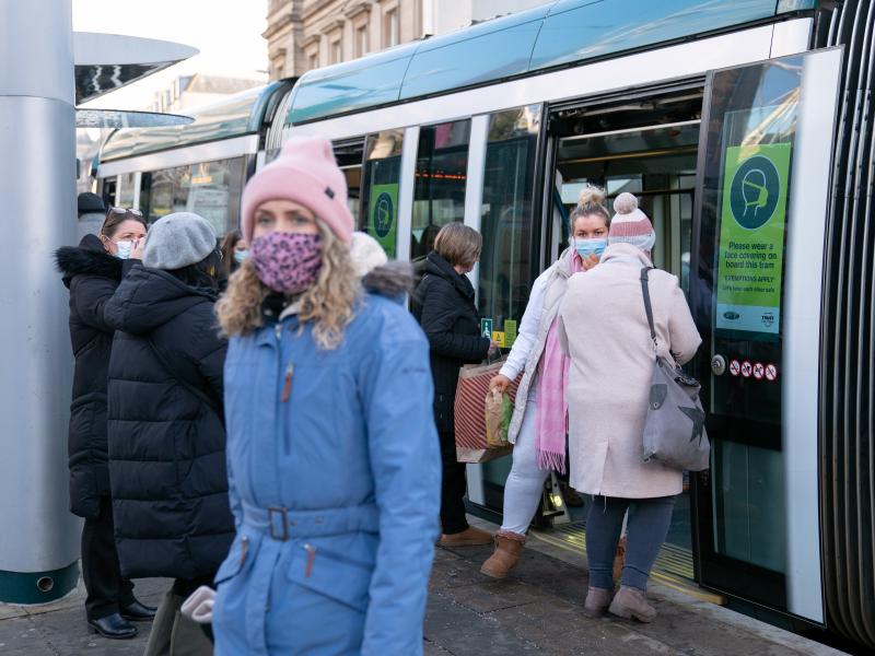 People step off a tram in Nottingham, England, a city where a case of the omicron variant of the coronavirus was identified last week. People step off a tram in Nottingham, England, a city where a case of the omicron variant of the coronavirus was identified last week.