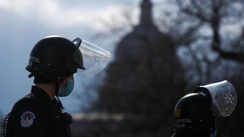 A U.S. Capitol Police officer stands guard outside the Capitol ahead of the inauguration for President Biden on Jan. 20. A U.S. Capitol Police officer stands guard outside the Capitol ahead of the inauguration for President Biden on Jan. 20.