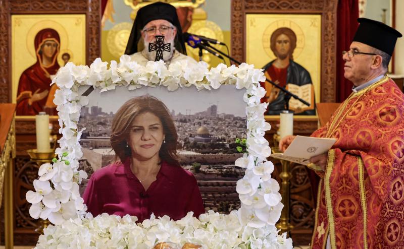 Archimandrite Abdullah Yulio, parish priest of the Melkite Greek Catholic church in Ramallah, speaks during a memorial service in June for the late Palestinian and veteran Al Jazeera journalist Shireen Abu Akleh. The Palestinian Authority says it has shar Archimandrite Abdullah Yulio, parish priest of the Melkite Greek Catholic church in Ramallah, speaks during a memorial service in June for the late Palestinian and veteran Al Jazeera journalist Shireen Abu Akleh. The Palestinian Authority says it has shar