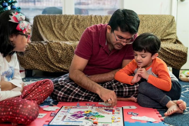 Dhaval Bhatt plays Monopoly with his children, Hridaya (left) and Martand, at their home in St. Peters, Missouri. Martand's mother took him to a children's hospital in April after he burned his hand, and the bill for the emergency room visit was more than Dhaval Bhatt plays Monopoly with his children, Hridaya (left) and Martand, at their home in St. Peters, Missouri. Martand's mother took him to a children's hospital in April after he burned his hand, and the bill for the emergency room visit was more than