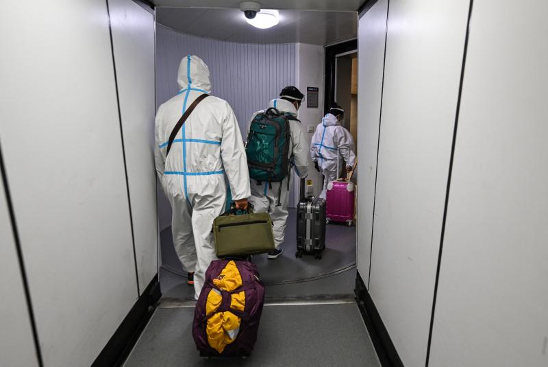 Masks are just one protective measure for these airline passengers arriving in Shanghai from Paris. Masks are just one protective measure for these airline passengers arriving in Shanghai from Paris.