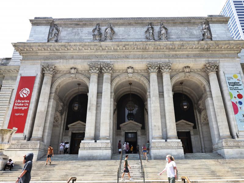People walk along the stairs of the New York Public Library on July 06, 2021 in Midtown Manhattan in New York City. People walk along the stairs of the New York Public Library on July 06, 2021 in Midtown Manhattan in New York City.