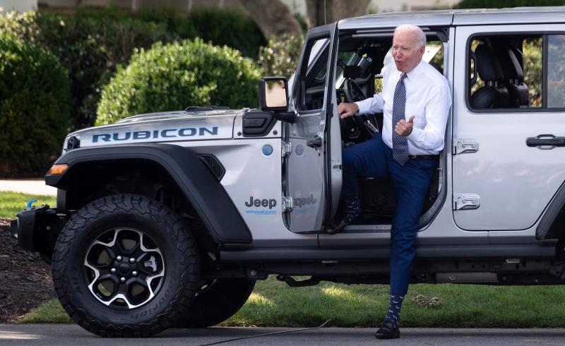 President Biden gets out of a Jeep Wrangler Rubicon 4xE after delivering remarks at the White House Thursday on electric vehicles and new fuel economy and emissions standards. President Biden gets out of a Jeep Wrangler Rubicon 4xE after delivering remarks at the White House Thursday on electric vehicles and new fuel economy and emissions standards.