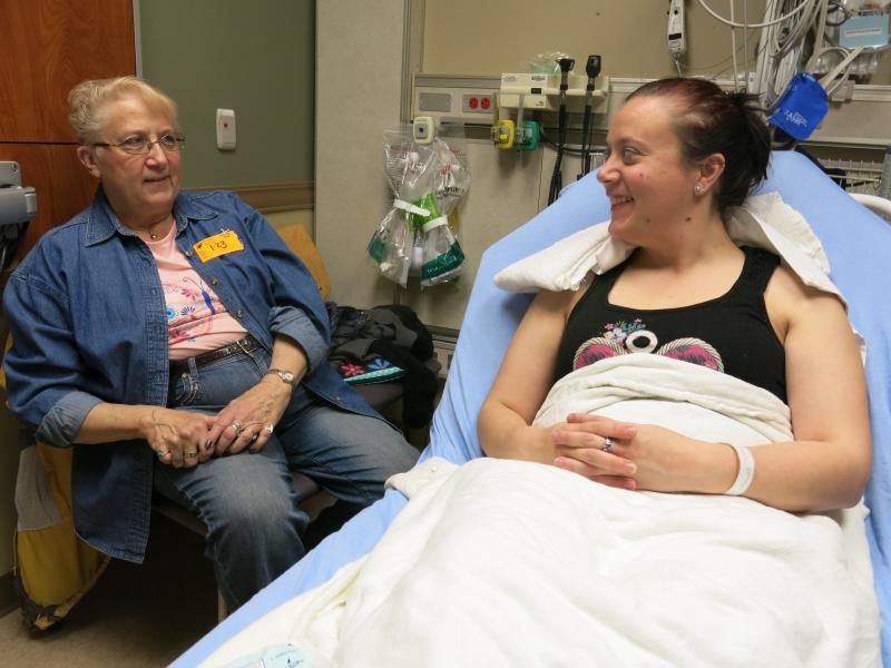 Ashley Copeland (right) talks to her mom Sue Iverson in the Swedish Medical Center emergency department, near Denver. Copeland got a nerve-blocking anesthetic instead of opioids to ease her severe headache. At discharge she was advised to use over-the-cou Ashley Copeland (right) talks to her mom Sue Iverson in the Swedish Medical Center emergency department, near Denver. Copeland got a nerve-blocking anesthetic instead of opioids to ease her severe headache. At discharge she was advised to use over-the-cou