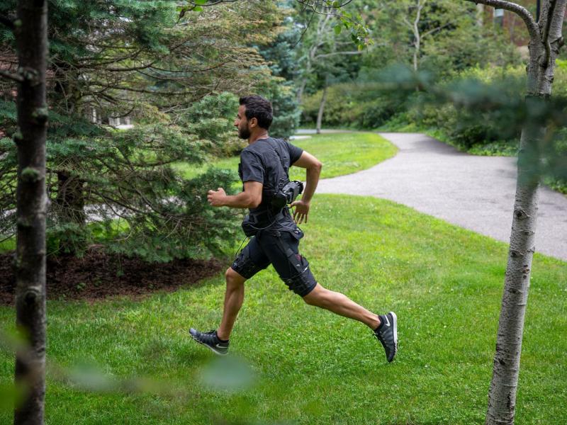 A Harvard research team's prototype of a portable exosuit is made of cloth components worn at the waist and thighs. A computer that's built into the shorts uses an algorithm that can sense when the user shifts between a walking gait and a and running gait A Harvard research team's prototype of a portable exosuit is made of cloth components worn at the waist and thighs. A computer that's built into the shorts uses an algorithm that can sense when the user shifts between a walking gait and a and running gait