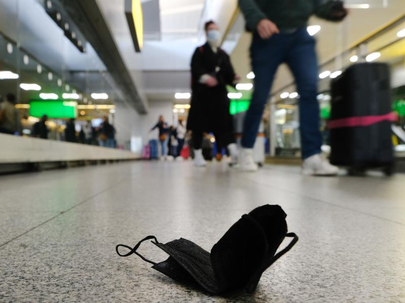 A mask is seen on the ground at John F. Kennedy Airport in New York City. On Monday, a federal judge in Florida struck down the mask mandate for airports and other methods of public transportation as a new COVID variant is on the rise across parts of the A mask is seen on the ground at John F. Kennedy Airport in New York City. On Monday, a federal judge in Florida struck down the mask mandate for airports and other methods of public transportation as a new COVID variant is on the rise across parts of the