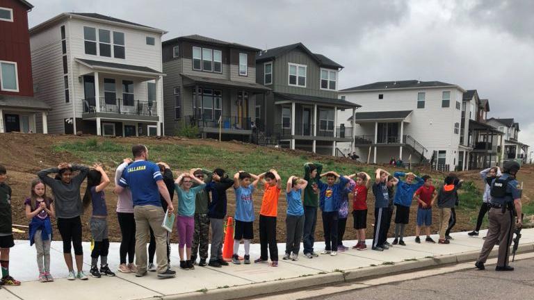 Students line up near STEM School Highlands Ranch during a shooting at the Colorado school that left one dead and eight injured on Tuesday. Students line up near STEM School Highlands Ranch during a shooting at the Colorado school that left one dead and eight injured on Tuesday.