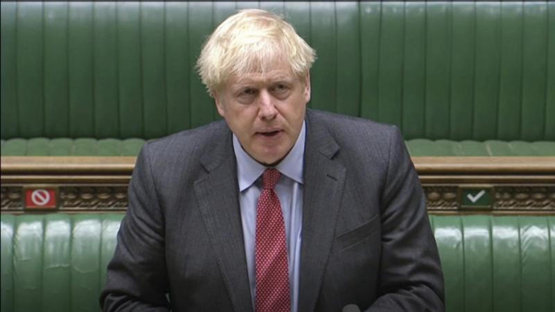 In this image taken from video, British Prime Minister Boris Johnson makes a statement to the House of Commons on the state of the COVID-19 pandemic. In this image taken from video, British Prime Minister Boris Johnson makes a statement to the House of Commons on the state of the COVID-19 pandemic.