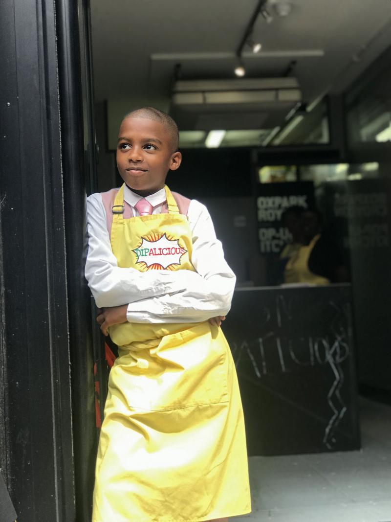 Chef Omari McQueen stands in the doorway of his vegan Caribbean pop-up restaurant Dipalicious. Chef Omari McQueen stands in the doorway of his vegan Caribbean pop-up restaurant Dipalicious.