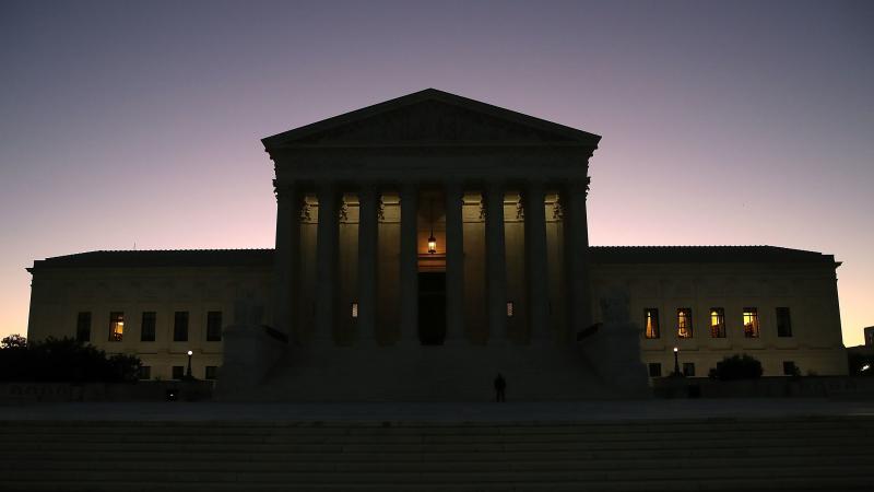 The sun begins to rise behind the U.S. Supreme Court on Monday, the first day of the high court's new session. The sun begins to rise behind the U.S. Supreme Court on Monday, the first day of the high court's new session.