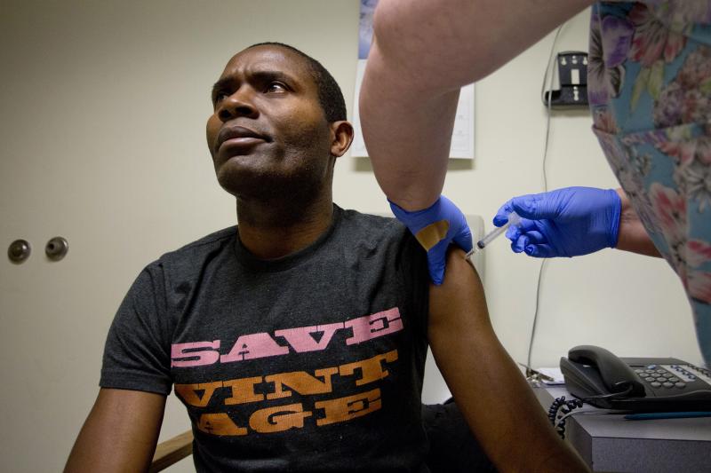Bruno Mbango Enyaka gets his flu shot at a community health center in Portland, Maine, on Jan. 7. Bruno Mbango Enyaka gets his flu shot at a community health center in Portland, Maine, on Jan. 7.
