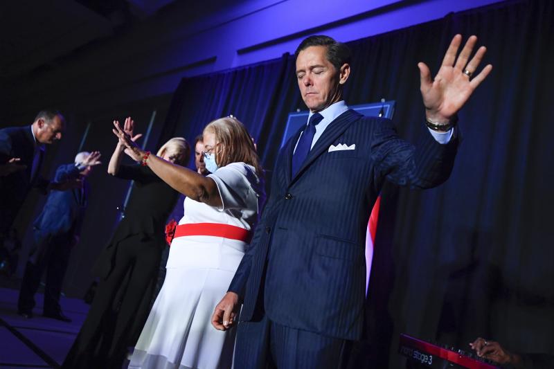 Ralph Reed prays on stage during a Donald Trump campaign event courting devout conservatives by combining praise, prayer and patriotism, Thursday, July 23, 2020, in Alpharetta, Ga. Ralph Reed prays on stage during a Donald Trump campaign event courting devout conservatives by combining praise, prayer and patriotism, Thursday, July 23, 2020, in Alpharetta, Ga.