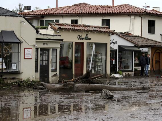 Debris and mud cover the street in front of shops in Montecito, Calif., Tuesday after heavy rain brought deadly flooding to the region. Debris and mud cover the street in front of shops in Montecito, Calif., Tuesday after heavy rain brought deadly flooding to the region.