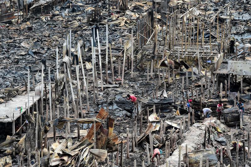 A fire that broke out on Friday night in the Bangladeshi capital, Dhaka, has left nearly 10,000 people homeless. The fire destroyed hundreds of shanties in a slum where many people are low-wage garment-factory workers. A fire that broke out on Friday night in the Bangladeshi capital, Dhaka, has left nearly 10,000 people homeless. The fire destroyed hundreds of shanties in a slum where many people are low-wage garment-factory workers.