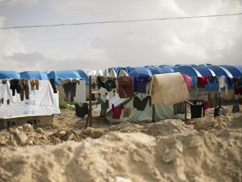 Laundry dries on a chain link fence in an area for foreign families of suspected ISIS fighters at al-Hol camp in Hassakeh province, Syria. Laundry dries on a chain link fence in an area for foreign families of suspected ISIS fighters at al-Hol camp in Hassakeh province, Syria.
