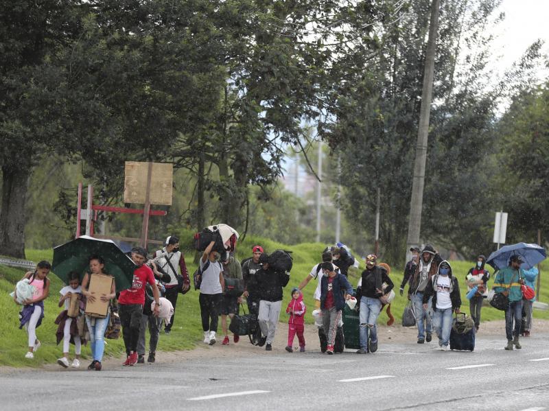Venezuelan migrants in Colombia walk toward the border amid the coronavirus lockdown. Colombian officials say 12,000 Venezuelans have taken buses back to their home country since Colombia imposed restrictions to stop the outbreak. Venezuelan migrants in Colombia walk toward the border amid the coronavirus lockdown. Colombian officials say 12,000 Venezuelans have taken buses back to their home country since Colombia imposed restrictions to stop the outbreak.