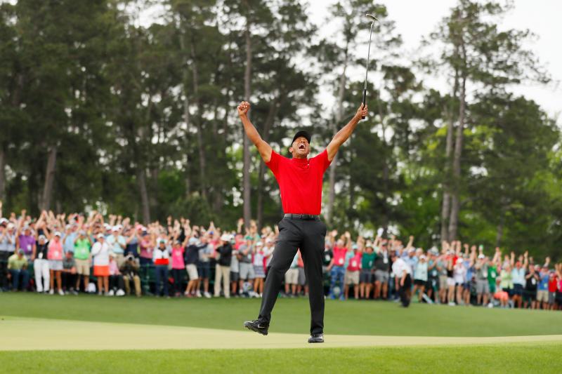 Tiger Woods celebrates after making his putt on the 18th green to win the Masters at Augusta National Golf Club on Sunday in Augusta, Georgia. Tiger Woods celebrates after making his putt on the 18th green to win the Masters at Augusta National Golf Club on Sunday in Augusta, Georgia.