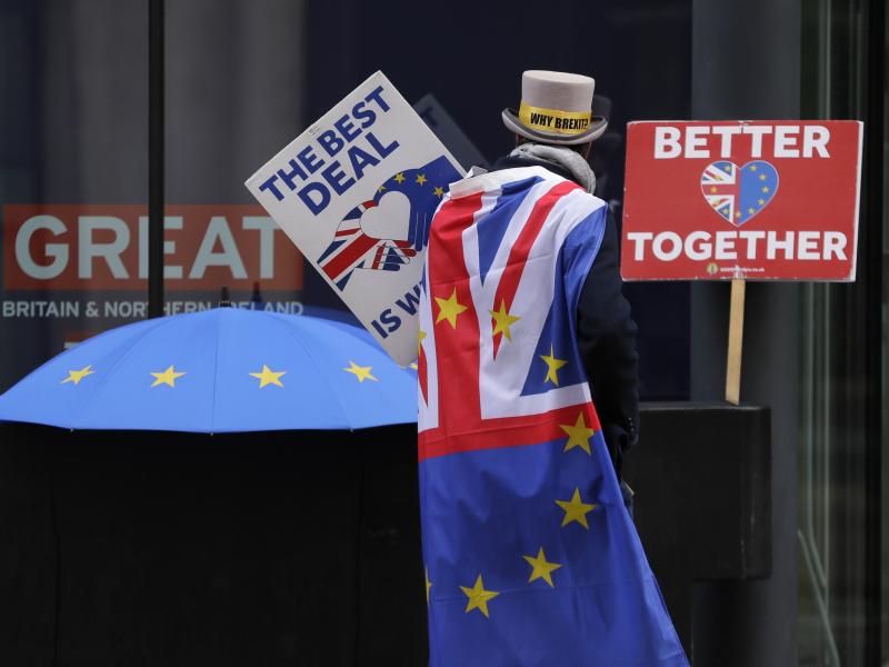 A pro-EU demonstrator sets up banners outside a London conference center, where trade talks were being held on Dec. 4. A pro-EU demonstrator sets up banners outside a London conference center, where trade talks were being held on Dec. 4.