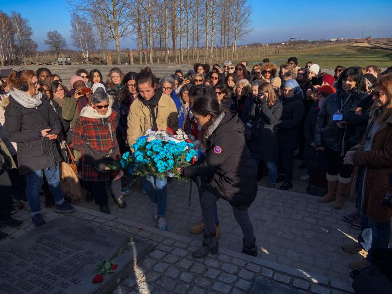 Members of a group of French women from diverse religious and ethnic backgrounds lay a wreath near the Auschwitz gas chambers earlier this month. After learning more about the horrors of the Holocaust, they hoped to bring greater understanding to their co Members of a group of French women from diverse religious and ethnic backgrounds lay a wreath near the Auschwitz gas chambers earlier this month. After learning more about the horrors of the Holocaust, they hoped to bring greater understanding to their co