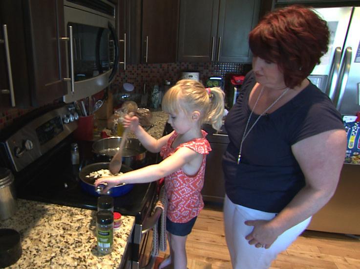 Sherri Erkel and her daughter, Asa, cook dinner in their kitchen in Iowa City, Iowa. The Erkel family is part of an EPA study measuring the amount of food wasted in U.S. homes. Sherri Erkel and her daughter, Asa, cook dinner in their kitchen in Iowa City, Iowa. The Erkel family is part of an EPA study measuring the amount of food wasted in U.S. homes.