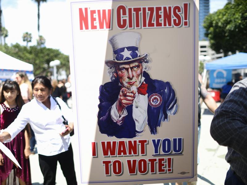 A sign encourages newly sworn-in U.S. citizens to register to vote outside a naturalization ceremony in 2019 in Los Angeles. After failing to get the now-blocked citizenship question on the 2020 census, the Trump administration is continuing to gather gov A sign encourages newly sworn-in U.S. citizens to register to vote outside a naturalization ceremony in 2019 in Los Angeles. After failing to get the now-blocked citizenship question on the 2020 census, the Trump administration is continuing to gather gov