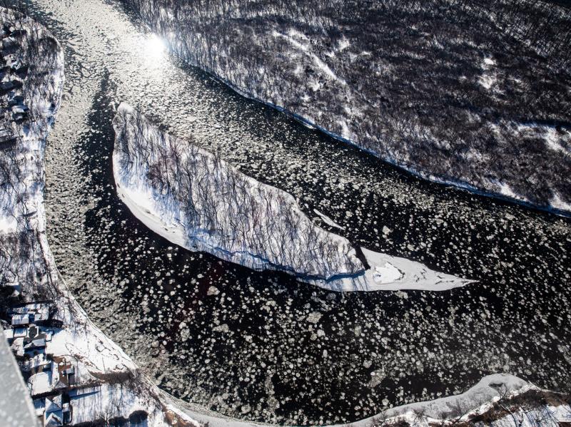 Ice flows around a small island in the Mississippi River near Dayton, Minn., on Feb. 13, 2020. Pilots take measurements to try and gauge how much water is in a snowpack. Ice flows around a small island in the Mississippi River near Dayton, Minn., on Feb. 13, 2020. Pilots take measurements to try and gauge how much water is in a snowpack.
