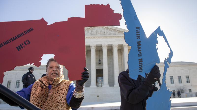Activists at the Supreme Court opposed to partisan gerrymandering hold up representations of congressional districts from North Carolina (left) and Maryland on March 26. On June 27, justices decided that the practice is beyond the reach of federal courts. Activists at the Supreme Court opposed to partisan gerrymandering hold up representations of congressional districts from North Carolina (left) and Maryland on March 26. On June 27, justices decided that the practice is beyond the reach of federal courts.