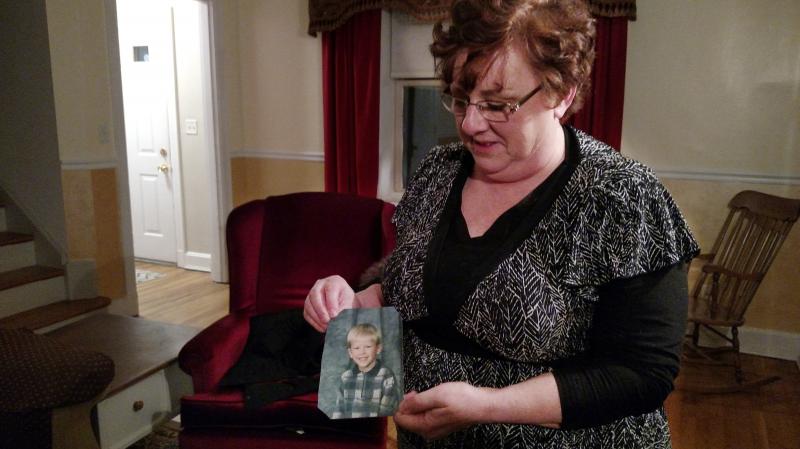 Toni Hoy, at her home in Rantoul, Ill., holds a childhood photo of her son, Daniel, who is now 24. In a last-ditch effort to get Daniel treatment for his severe mental illness in 2007, the Hoys surrendered parental custody to the state. "When I think of h Toni Hoy, at her home in Rantoul, Ill., holds a childhood photo of her son, Daniel, who is now 24. In a last-ditch effort to get Daniel treatment for his severe mental illness in 2007, the Hoys surrendered parental custody to the state. "When I think of h