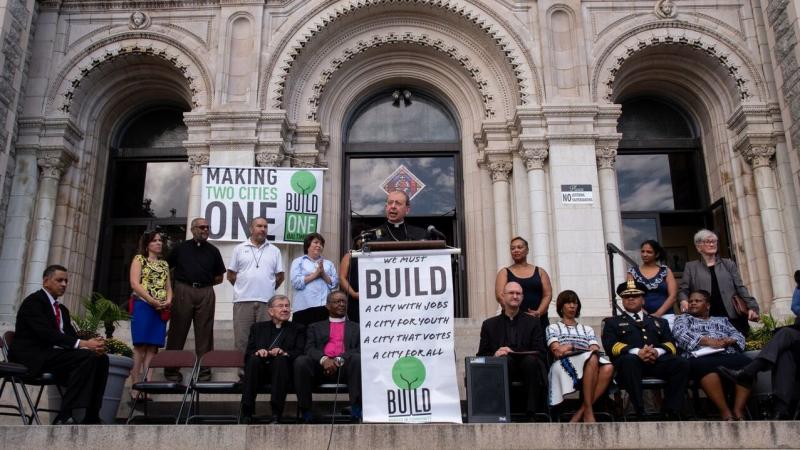 Archbishop William Lori announced a new program to issue parishioner ID cards outside a Baltimore church on Wednesday. Archbishop William Lori announced a new program to issue parishioner ID cards outside a Baltimore church on Wednesday.