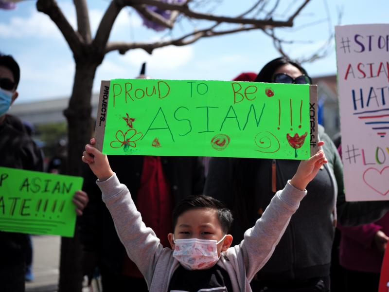 A boy holding a sign takes part in a Stop Asian Hate rally in Oakland, Calif. A boy holding a sign takes part in a Stop Asian Hate rally in Oakland, Calif.