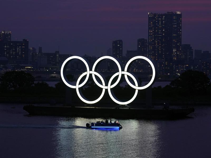 The Olympic rings float in the water at sunset in the Odaiba section in Tokyo earlier this month. The Olympic rings float in the water at sunset in the Odaiba section in Tokyo earlier this month.