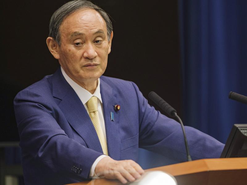 Japanese Prime Minister Yoshihide Suga will extend a state of emergency to four more prefectures due to rising coronavirus infections. Here, Suga addresses a news conference on July 8. Japanese Prime Minister Yoshihide Suga will extend a state of emergency to four more prefectures due to rising coronavirus infections. Here, Suga addresses a news conference on July 8.
