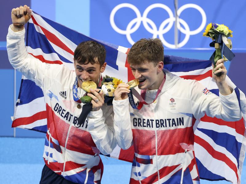 Tom Daley, left, and Matty Lee celebrate their win in the men's synchronized 10m platform final on day three of the Tokyo 2020 Olympic Games. Tom Daley, left, and Matty Lee celebrate their win in the men's synchronized 10m platform final on day three of the Tokyo 2020 Olympic Games.