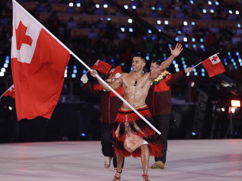 Pita Taufatofua makes an entrance during the opening ceremony of the 2018 Pyeongchang Winter Olympics. Taufatofua competed in taekwondo and cross-country skiing, but he's most famous for carrying the flag of Tonga for three consecutive Games, stealing the Pita Taufatofua makes an entrance during the opening ceremony of the 2018 Pyeongchang Winter Olympics. Taufatofua competed in taekwondo and cross-country skiing, but he's most famous for carrying the flag of Tonga for three consecutive Games, stealing the